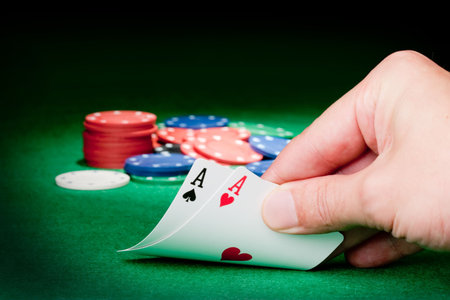 Stack of chips and two aces