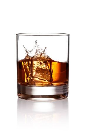 Whiskey splash. Isolated on white backgroundの写真素材