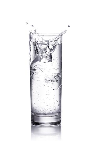 water splash in a glass.  isolated on whiteの写真素材