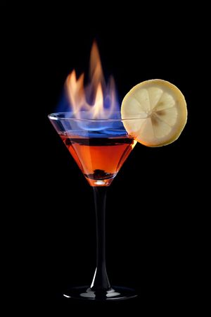 Flaming cocktail over blackの写真素材