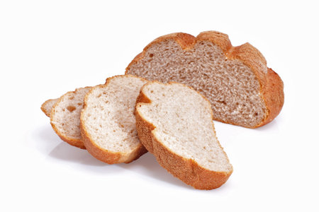 Sliced homemade brown bread, isolated on white