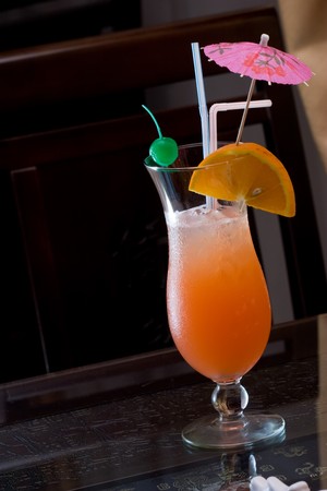 Fresh iced cocktail garnished orange and umbrella
の写真素材
