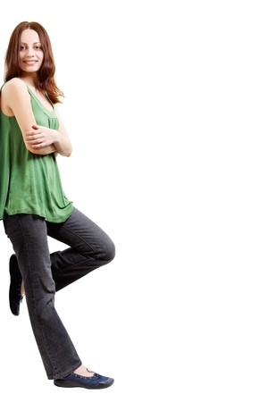 Young woman leaning against something, on a white backgroundの写真素材