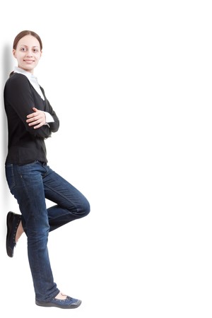 Young woman leaning against something, on a white backgroundの写真素材