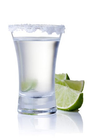 shot glass filled with clear cold alcoholの写真素材