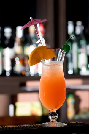 Fresh iced cocktail garnished orange and umbrella
の写真素材