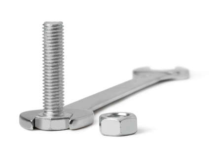Chrome spanner, nuts and bolts on a white backgroundの写真素材