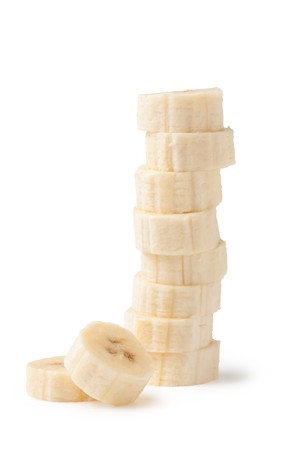 Freshly sliced bananas on a white backgroundの写真素材