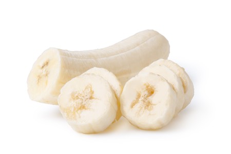 Freshly sliced bananas on a white backgroundの写真素材