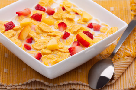 cornflakes with milk and strawberries