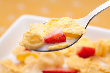 cornflakes with milk and strawberries