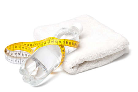Bottle of water, towel and tape measure isolated on white backgroundの写真素材