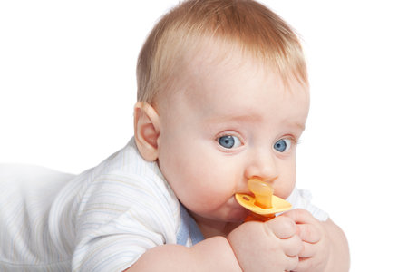 baby with a pacifier isolated on white background