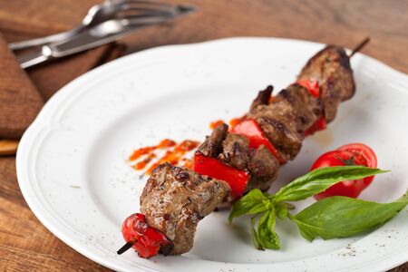 Beef Kebab  on a white plateの写真素材
