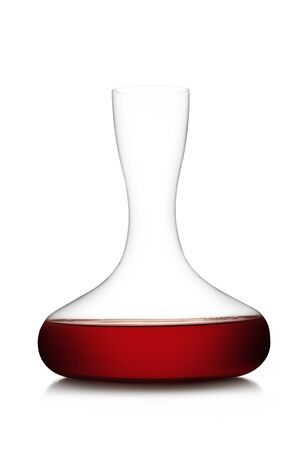 Red wine on a decanter isolated over white backgroundの写真素材