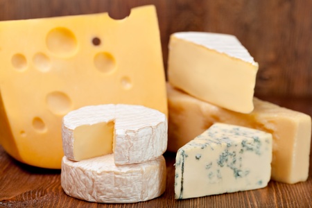 delicious cheese on a wooden tableの写真素材