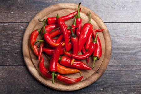Fresh red pepper on a wooden table