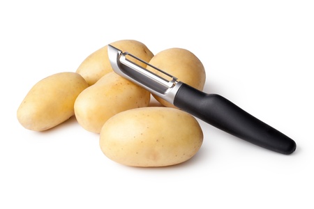 Potatoes and Peeler on a white backgroundの写真素材