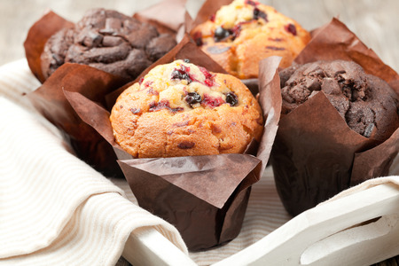 blueberry and chocolate muffins in paper cupcake holderの写真素材