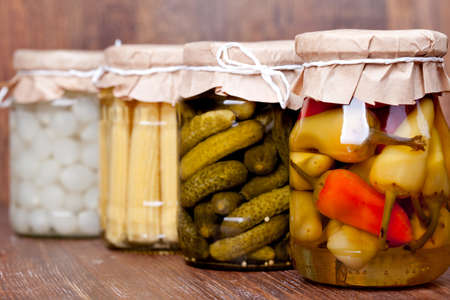 Preserved vegetable on a wooden tableの写真素材
