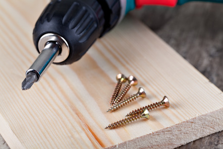Battery screwdriver and screwの写真素材
