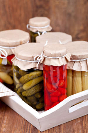 Preserved vegetable on a wooden tableの写真素材