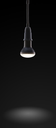 Energy saving LED light bulb isolated on a black bakgroundの写真素材
