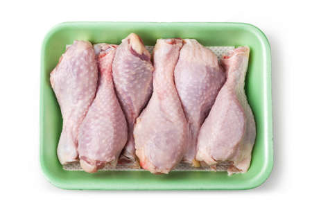 Pieces of raw chicken meat on a white backgroundの写真素材