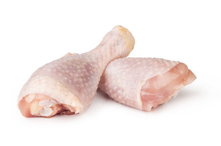 Pieces of raw chicken meat on a white backgroundの写真素材