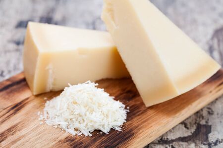 parmesan cheese on wooden backgroundの写真素材