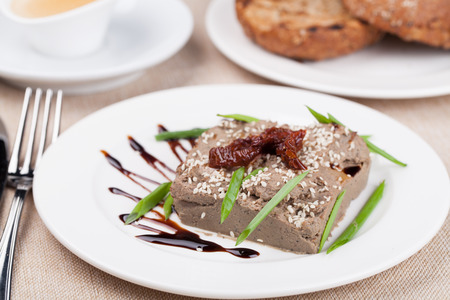 liver pate on a white plateの写真素材