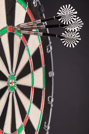 darts arrows in the targetの写真素材