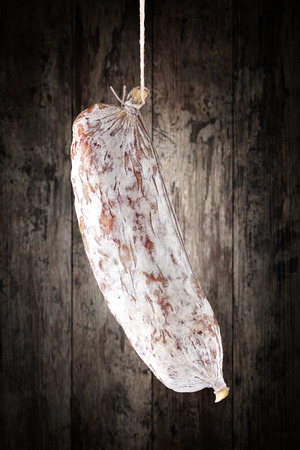salami on a wooden backgroundの写真素材