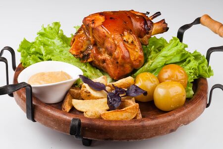 Appetizing roast pork knuckle on cutting boardの写真素材