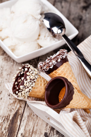 ice cream and strawberries on a wooden table