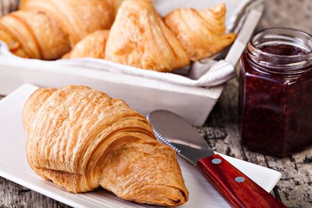 Fresh Croissants on wooden rustic backgroundの写真素材