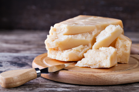 the parmesan cheese on cutting boardの写真素材