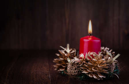 Christmas decoration with candles over dark backgroundの写真素材