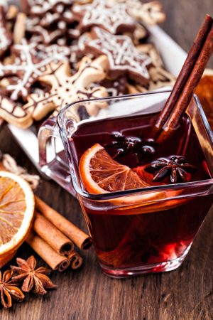 Mulled wine and spices on wooden backgroundの写真素材