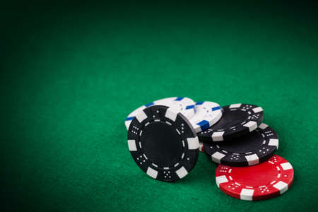 Casino chips on the green tableの写真素材