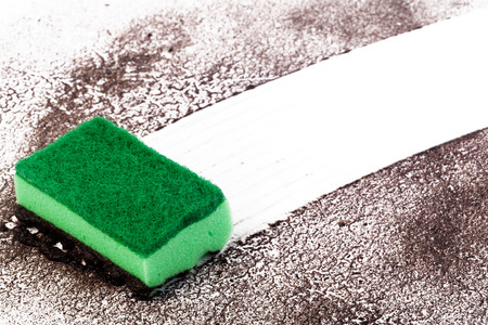 Cleaning trace sponge on a dirty gray wallの写真素材