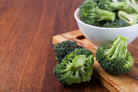 fresh broccoli on a wooden tableの写真素材