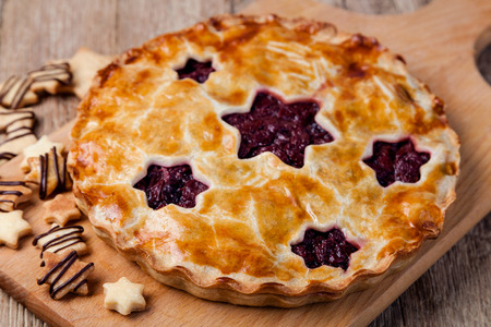 homemade cherry pie on a wooden tableの写真素材