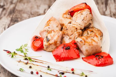 Chicken kebabs on a plateの写真素材