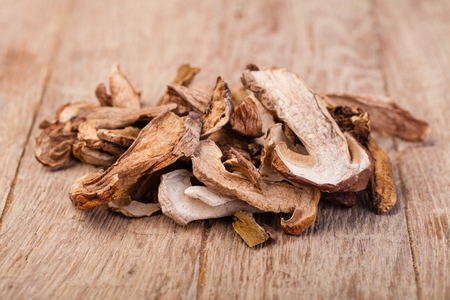 dried mushrooms, on a wooden tableの写真素材