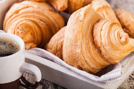 Fresh Croissants on wooden rustic backgroundの写真素材