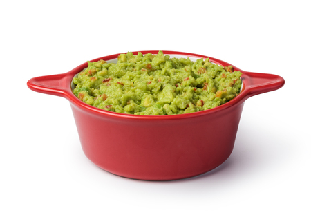 Guacamole in a bowl on a white backgroundの写真素材