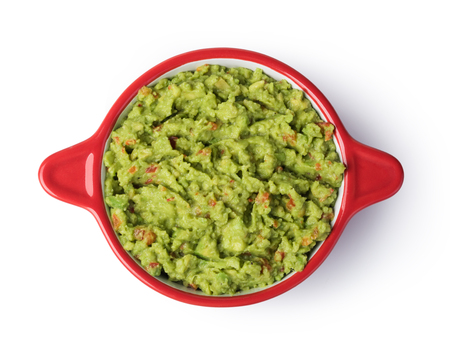 Guacamole in a bowl on a white backgroundの写真素材