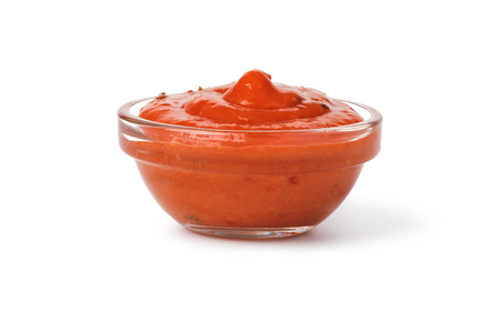 Bowl with ketchup isolated on white backgroundの写真素材