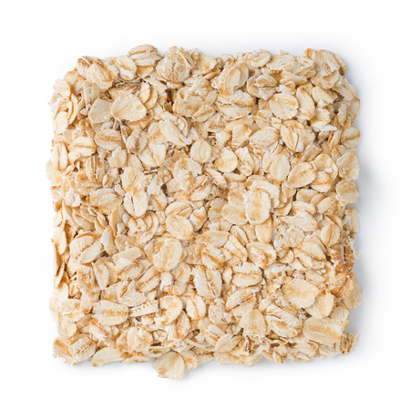 Oatmeal flakes isolated on white backgroundの写真素材